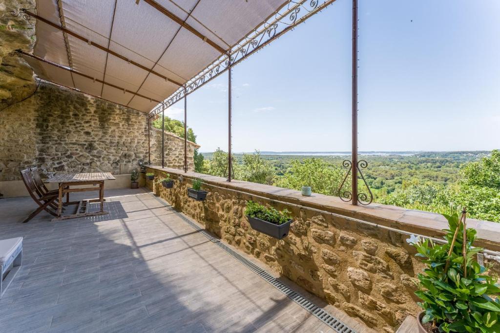 a view from the balcony of a house at Studio Troglodyte en Provence in Cornillon-Confoux