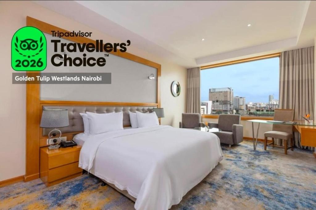 a hotel room with a large bed and a large window at Golden Tulip Westlands Nairobi in Nairobi