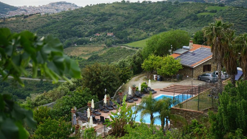an aerial view of a house with a swimming pool at Il Falco del Cilento in Torchiara