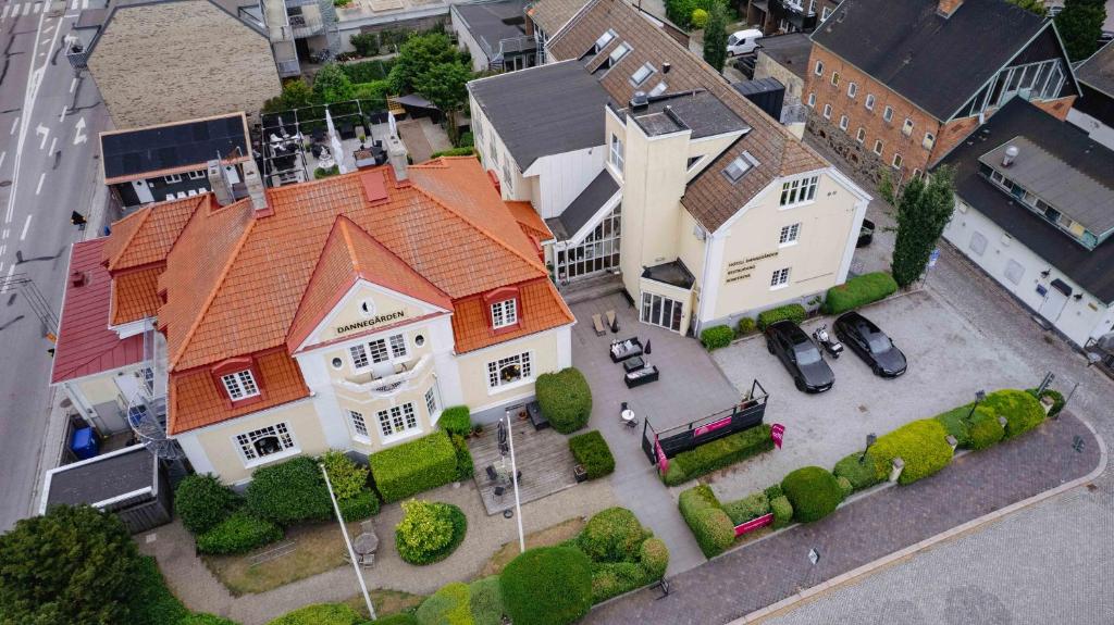 an aerial view of a large house with cars parked in front at Hotell Dannegården in Trelleborg
