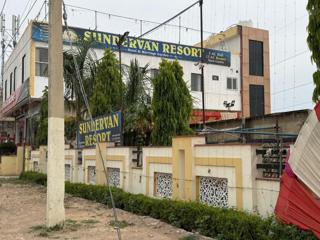 a street sign in front of a building at Sundervan Resort in Alwar