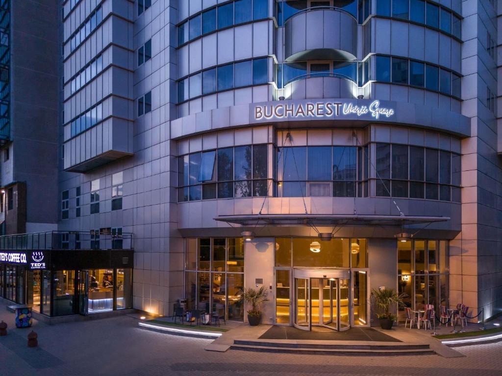 a building with a sign that reads bluegrass first hotel group at Handwritten Collection-Bucharest Unirii Square in Bucharest