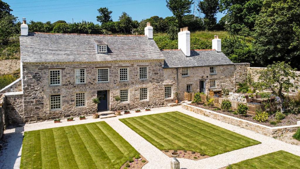 an aerial view of a house with a large yard at Cusgarne Manor boutique B&B - adults only in Cusgarne