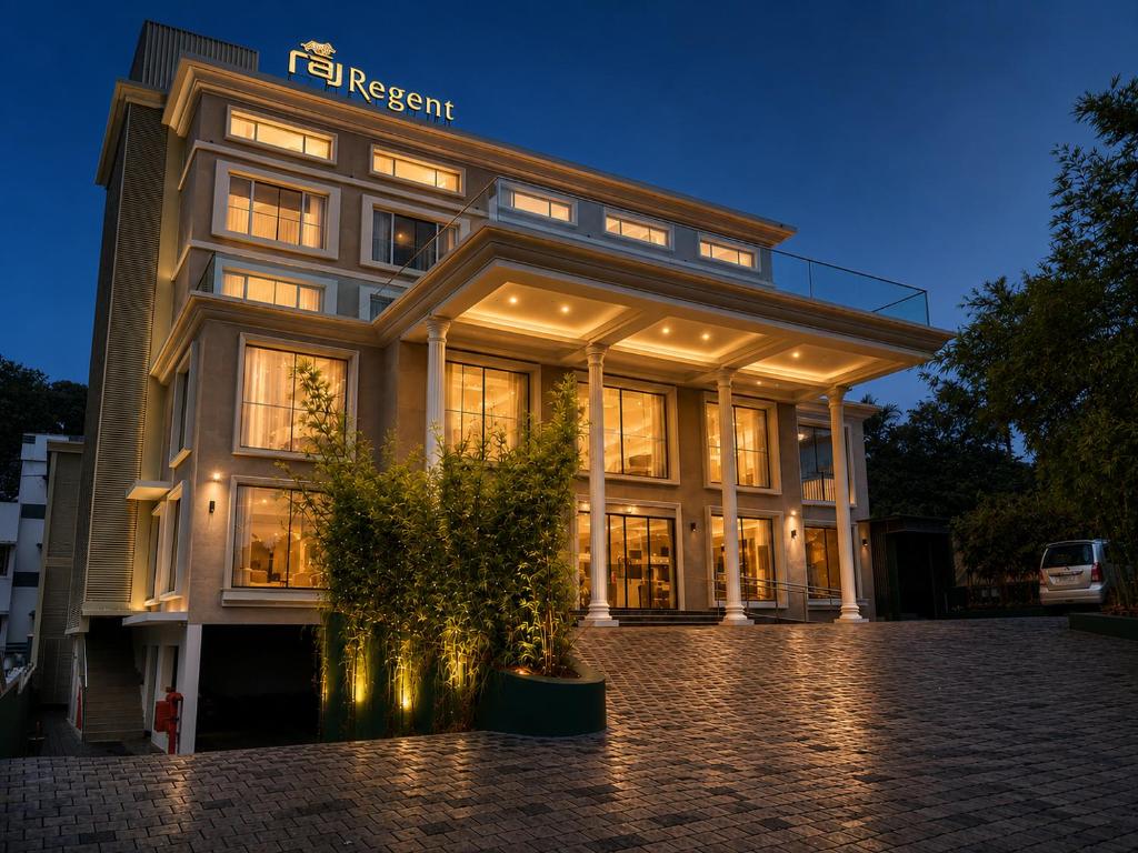 a large building with a lot of windows at Raj Regent Manarcadu in Kanjirapalli