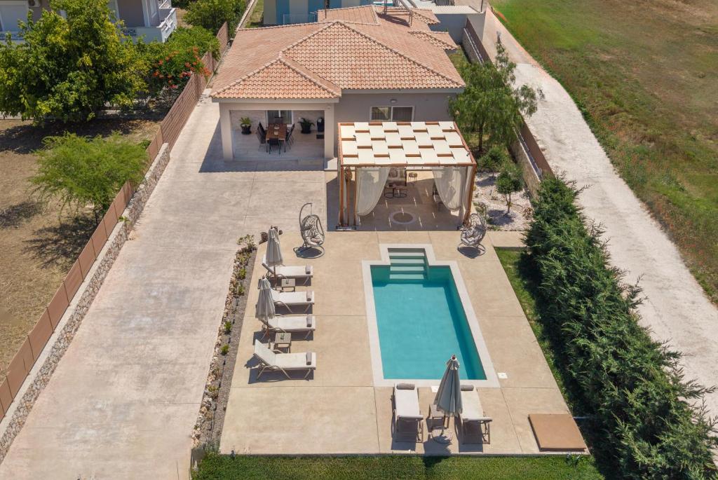 an overhead view of a house with a swimming pool at Villa Nicoldia with private pool near Laganas in Laganas