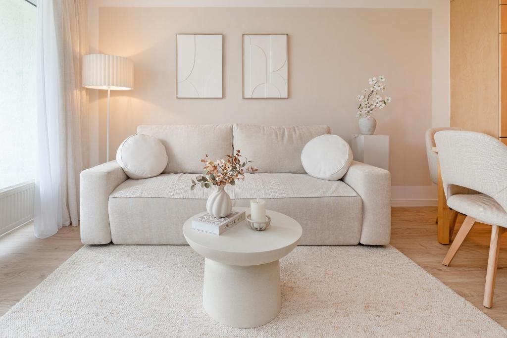 a living room with a couch and a table at Baltic Studio No 5 in Scharbeutz