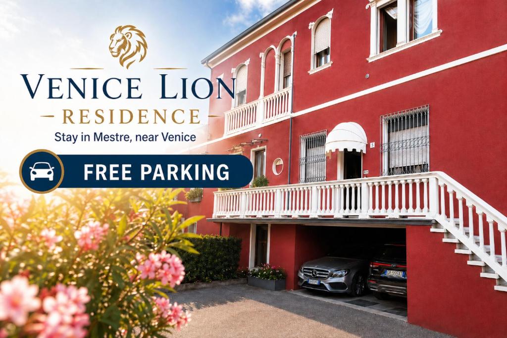 a red building with a car parked in the garage at Venice Lion Residence Free Private Parking Easy Access Venice in Mestre
