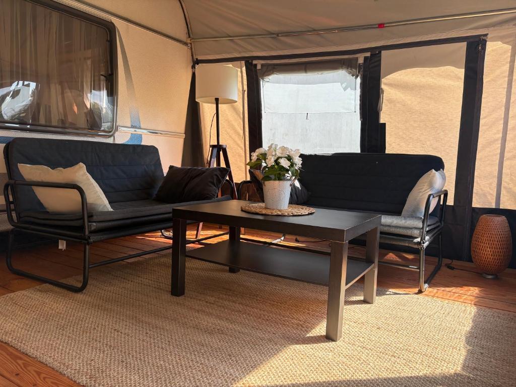 a living room with a couch and a coffee table at Platin Pure in Jastarnia