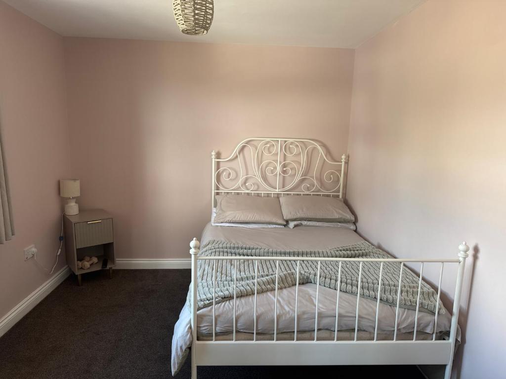 a small bedroom with a white bed in a room at Thornley pit house farm in Durham