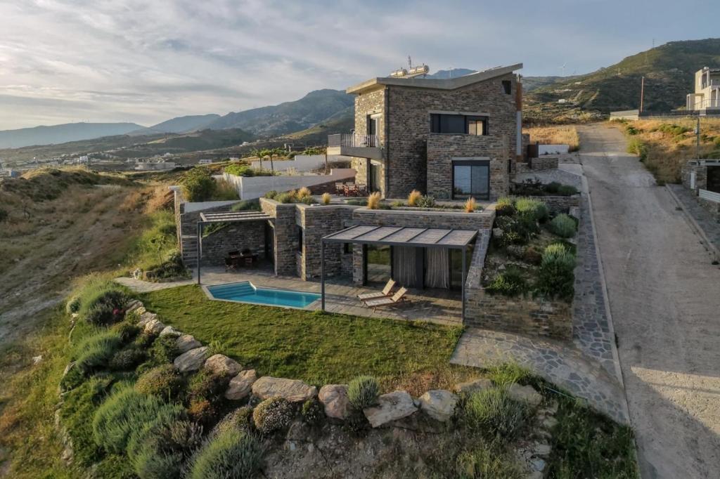 an aerial view of a house on a hill at Μαυρόλιθος in Karistos