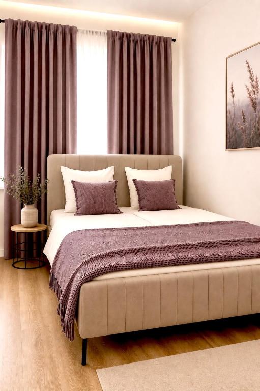 a bedroom with a large bed in front of a window at City Apartment in Siegen Parkplatz WLAN Autobahn in Siegen