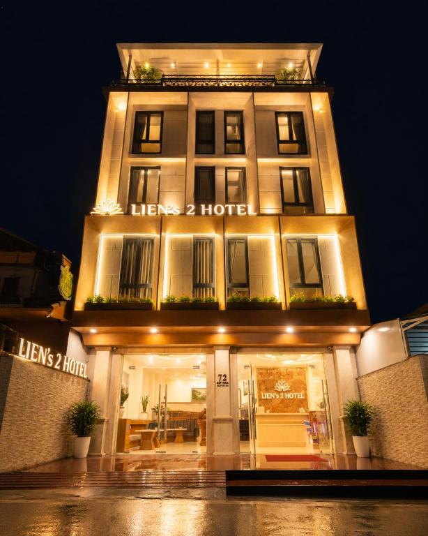 a lit up building with a hotel at night at Lien's 2 Hotel Dalat in Da Lat