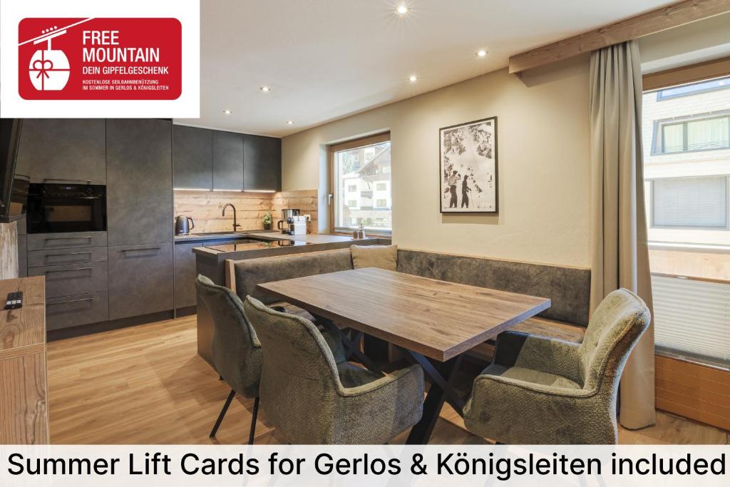 a kitchen with a wooden table and chairs at Apartment Gerlos 183 in Gerlos