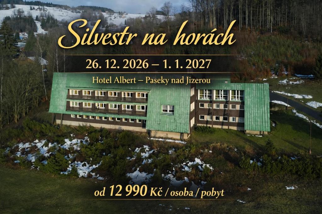 a building with a sign that reads university no mortar at Hotel Albert - RETRO in Paseky nad Jizerou