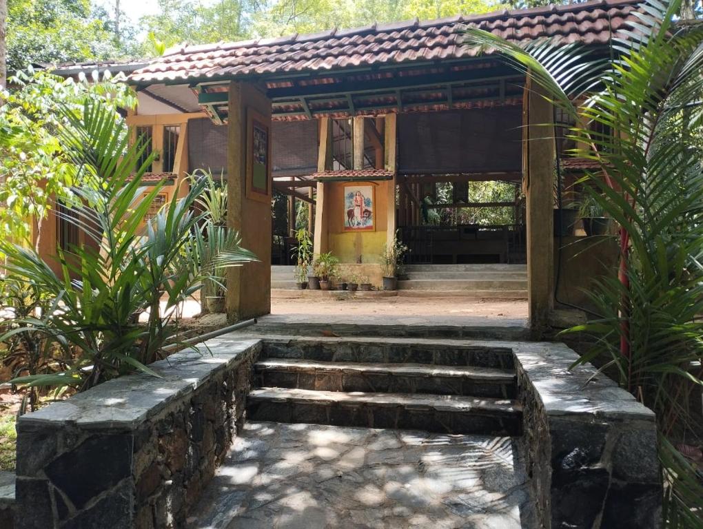 a building with stairs in front of it at Makelioya Nature Resort in Kelinkanda