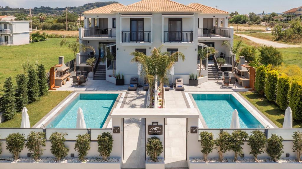 an aerial view of a house with a swimming pool at Eagle's Nest - Adjoining Villas! in Tsilivi