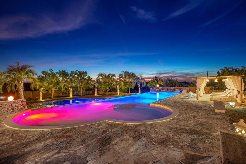 an image of a swimming pool at night at Masseria Marchese by Perle di Puglia in Montesano Salentino