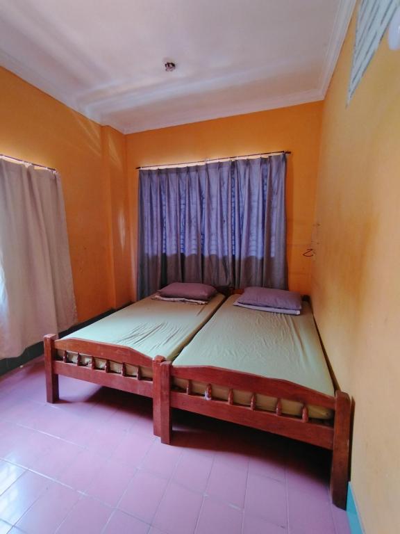 a bedroom with two beds in a room at Monica's house in Phnom Penh