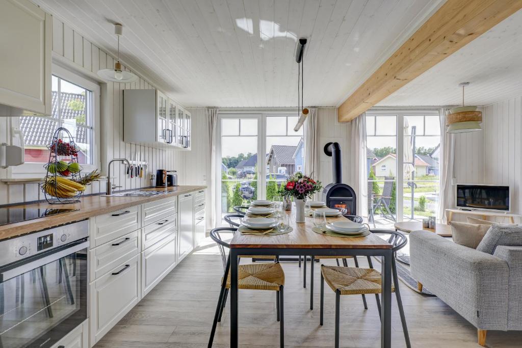 a kitchen with a table and chairs in a room at Schiller in Wandlitz