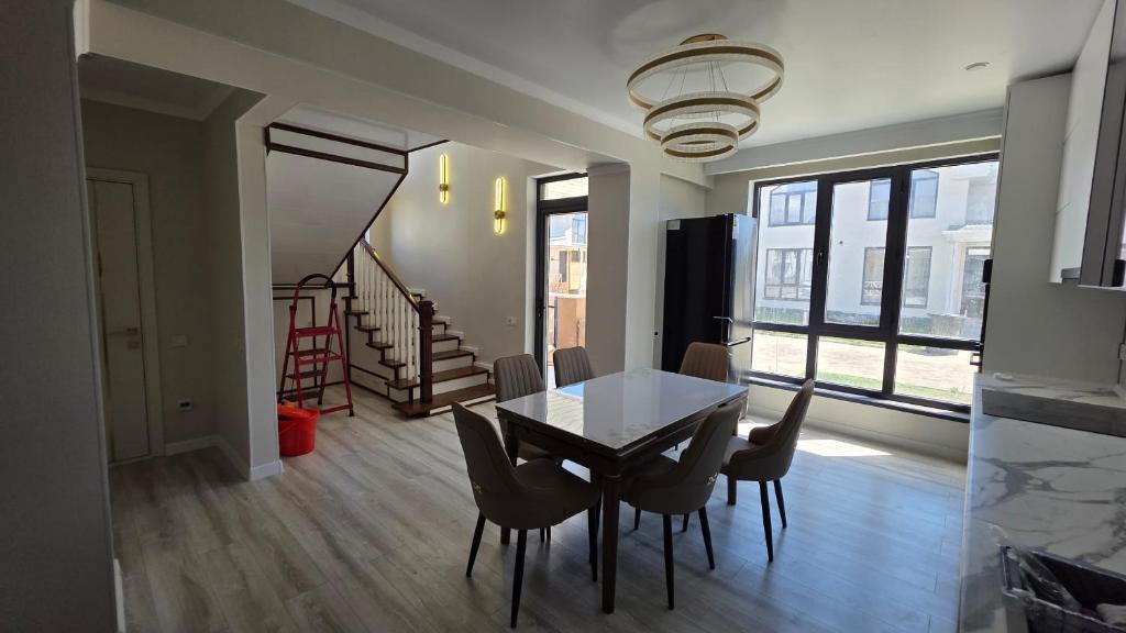 a dining room with a table and chairs at Cottage in Bosteri