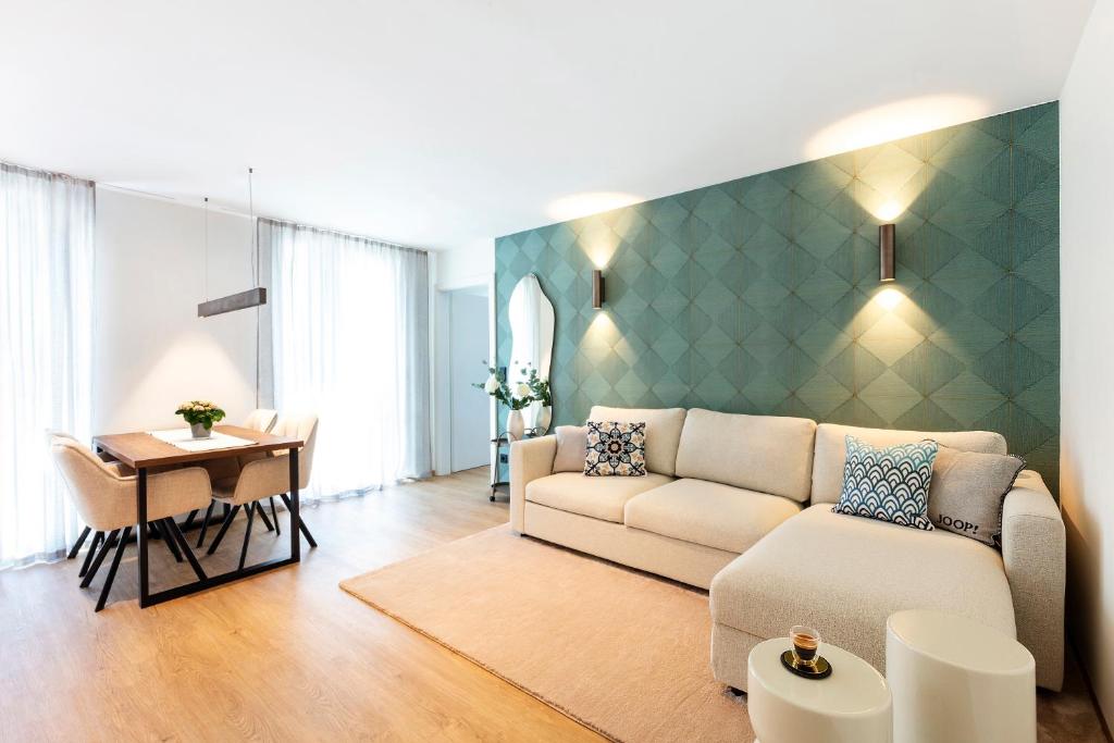 a living room with a couch and a table at Nomes Apartment in Axams