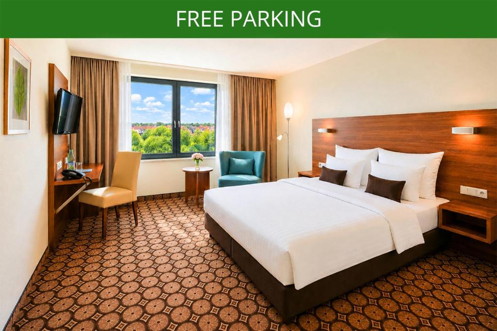 a hotel room with a bed and a desk and a television at CZECH INN Hotel Ferenc in Budapest
