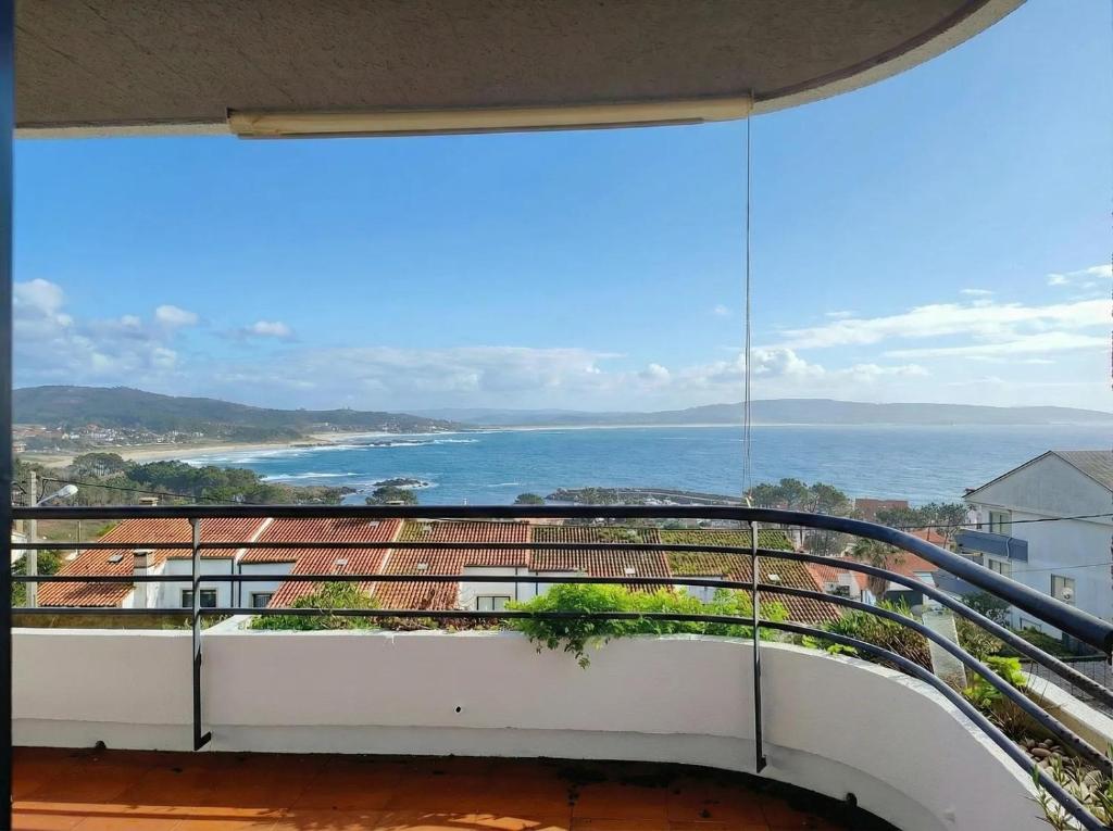 a balcony with a view of the ocean at URB. PEDRAS NEGRAS in Pontevedra