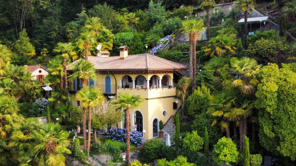 an aerial view of a house with palm trees at Villa Zanotti in Cannero Riviera