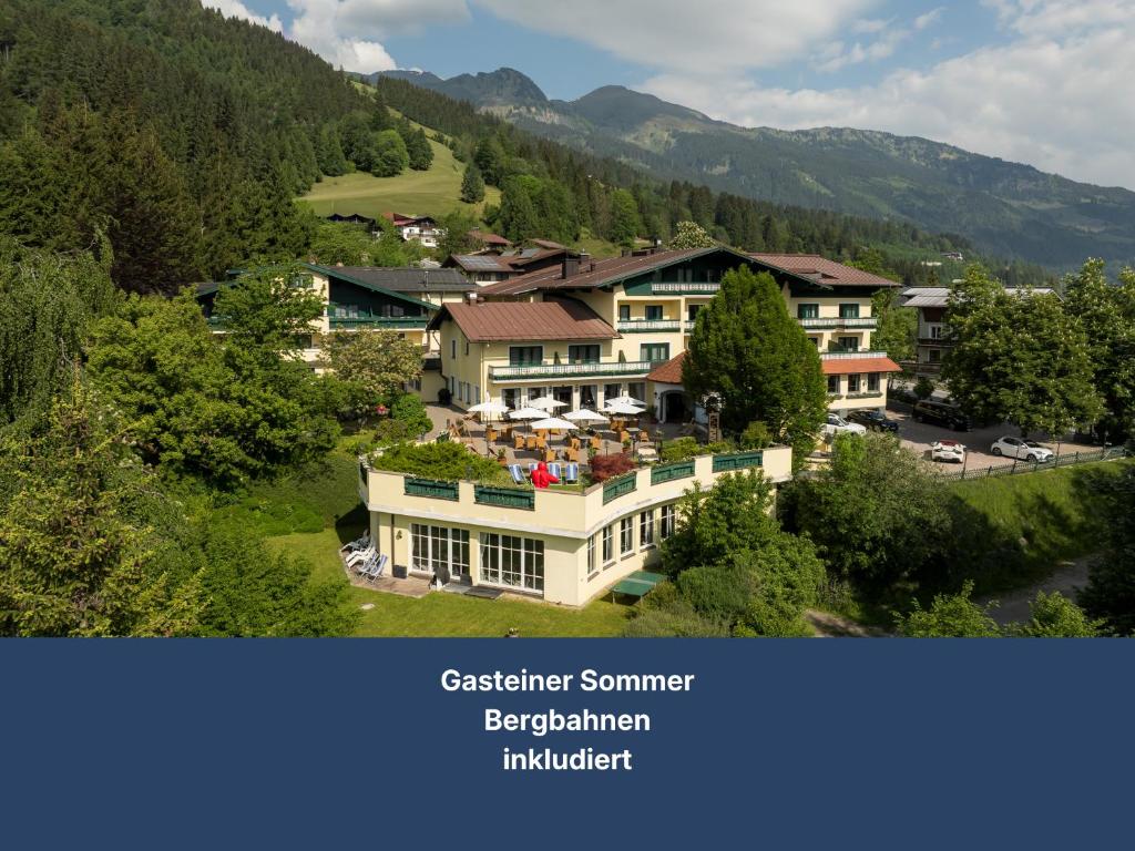arial view of a resort in the mountains at Hotel Zum Stern inkl Gasteiner Bergbahnen im Sommer in Bad Hofgastein