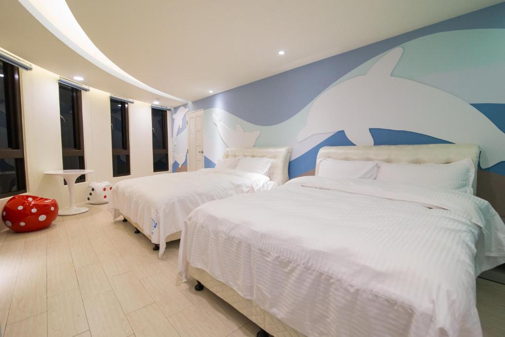 Postel nebo postele na pokoji v ubytování Shell Sand Homestay