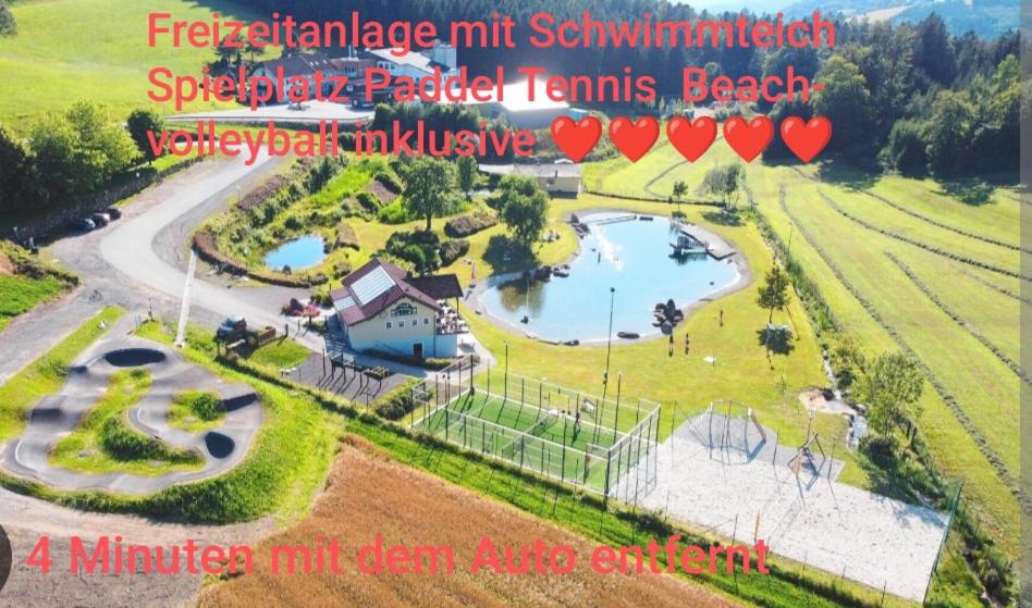 an aerial view of a park with a pond at Ferienwohnung Rotheneder- Rupp in Niederndorf