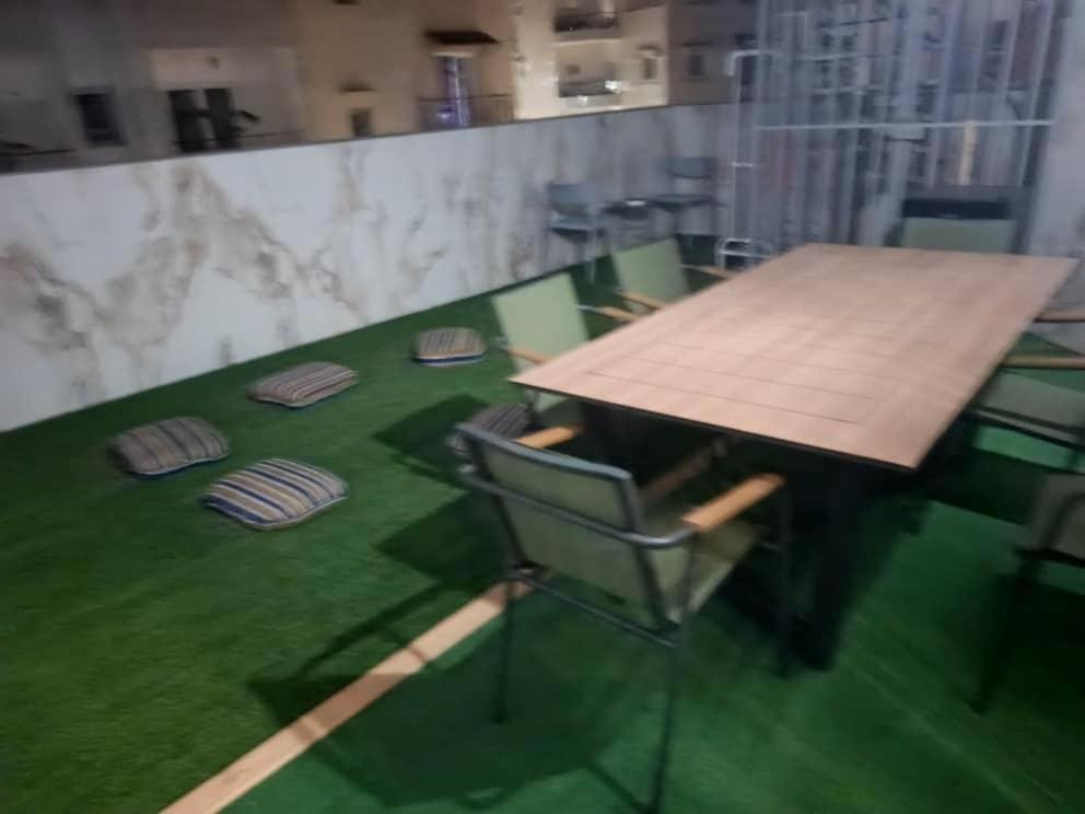 a table and a chair in a room at Chez sesa in Dakar