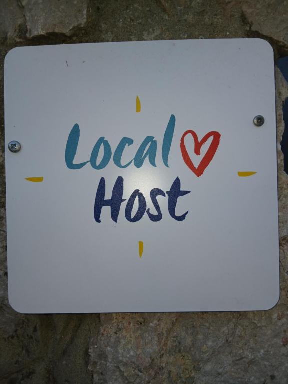 a sign that says local hottest with a heart at Gita in Omišalj