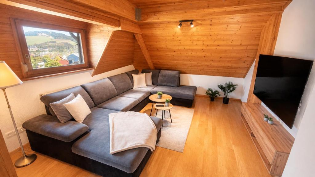 an overhead view of a living room with a couch and a television at Ferienwohnung Saarburg in Saarburg