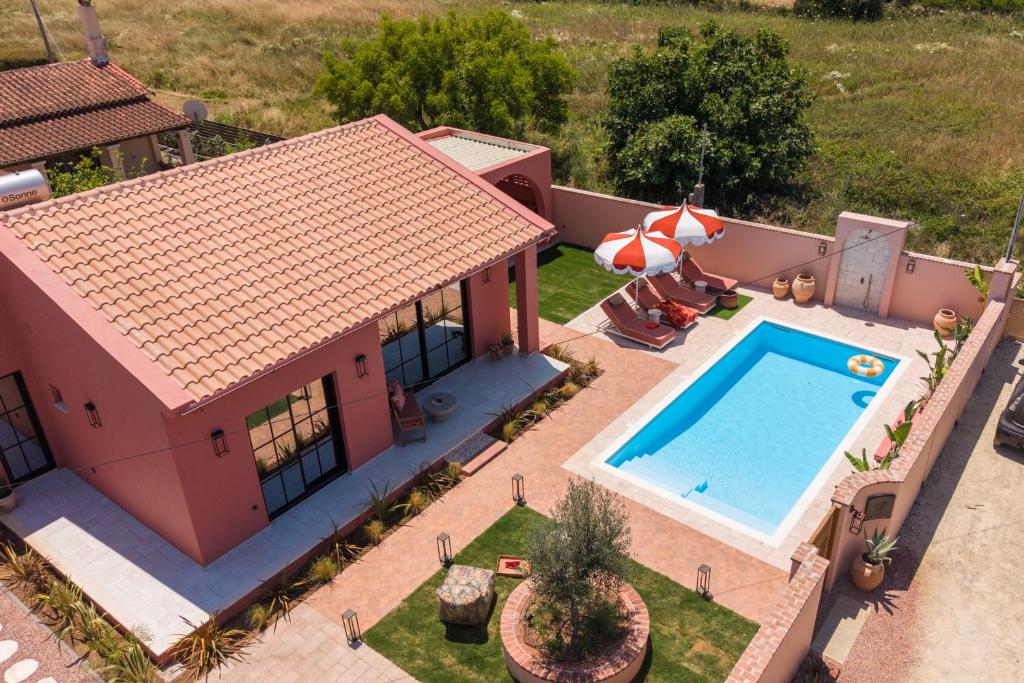 an aerial view of a house with a swimming pool at Casa Tortuga - Exclusive Villa Corfu in Acharavi