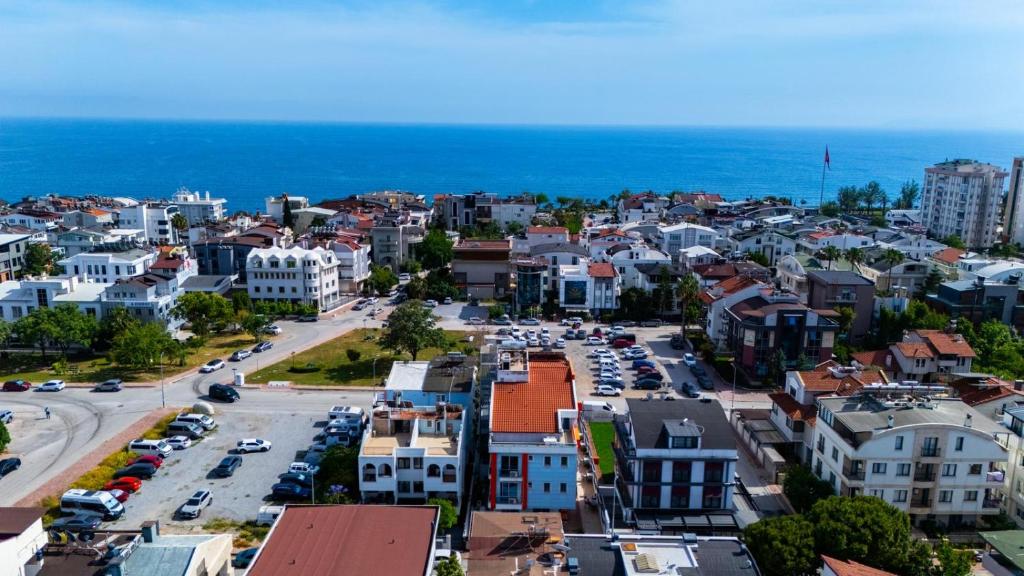 an aerial view of a city with the ocean at Hey Lara Hotel in Antalya