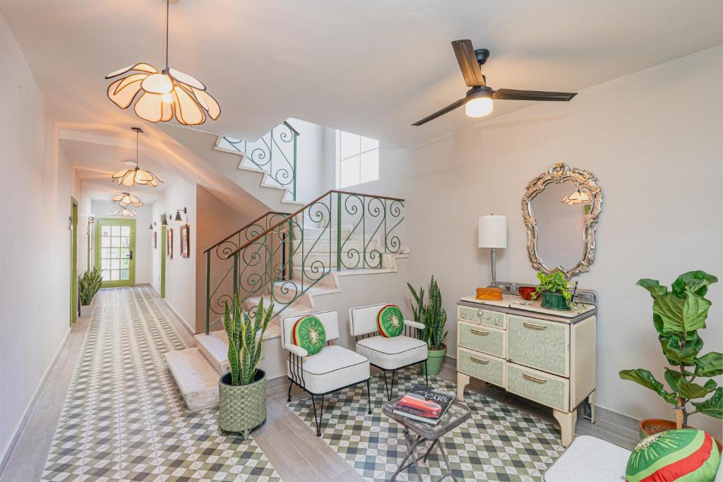 a living room with a staircase with plants at Casa Verde in Monterrey