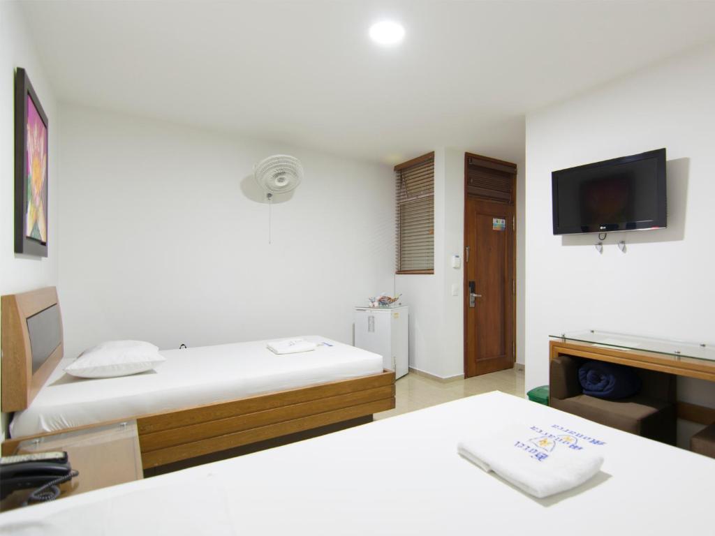 Postel nebo postele na pokoji v ubytování Hotel Monarca