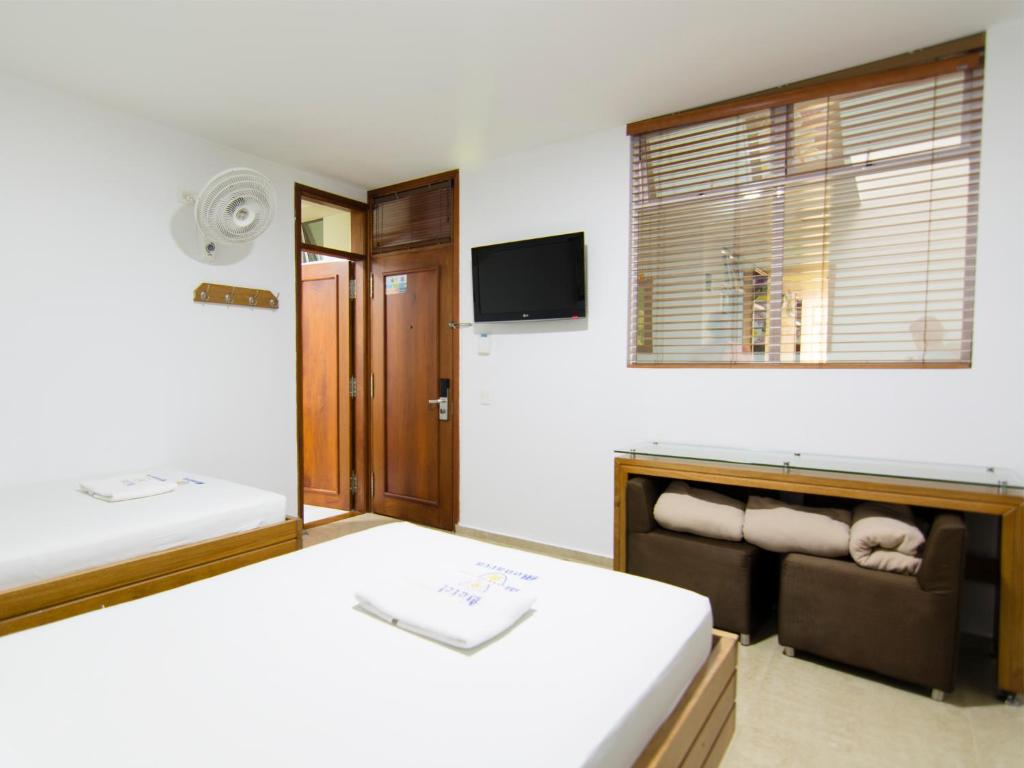 Postel nebo postele na pokoji v ubytování Hotel Monarca
