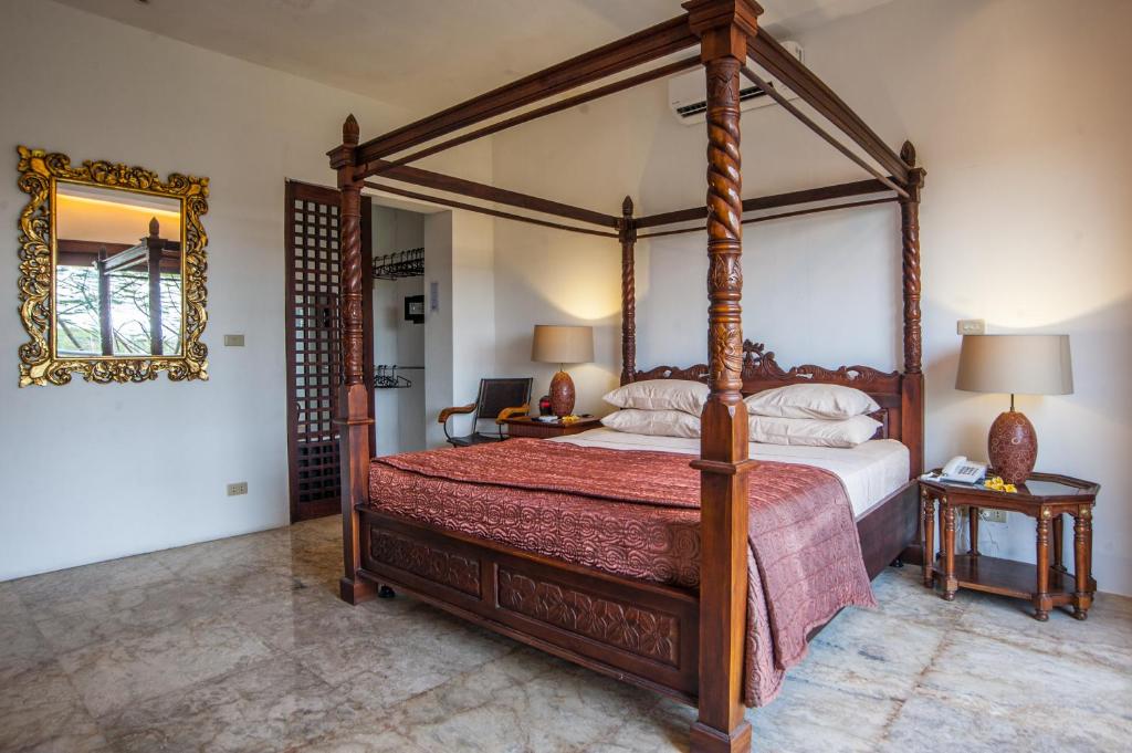 Postel nebo postele na pokoji v ubytování Bali Mystique Hotel & Apartment