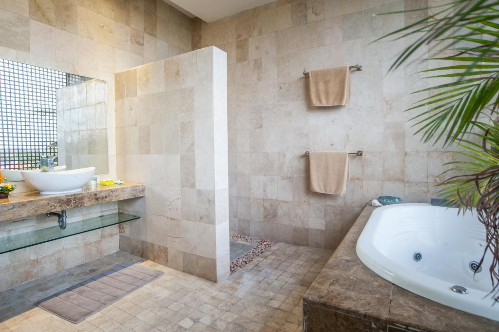 Koupelna v ubytování Bali Mystique Hotel & Apartment