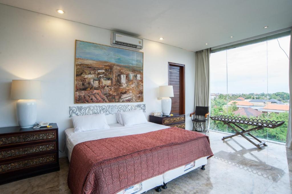 Postel nebo postele na pokoji v ubytování Bali Mystique Hotel & Apartment