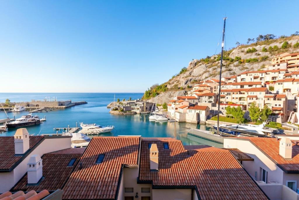 a view of a harbor with boats in the water at Portopiccolo Apartments in Sistiana