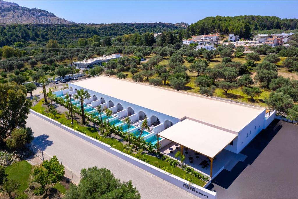 an aerial view of a building with a swimming pool at Neya Elements in Lartos