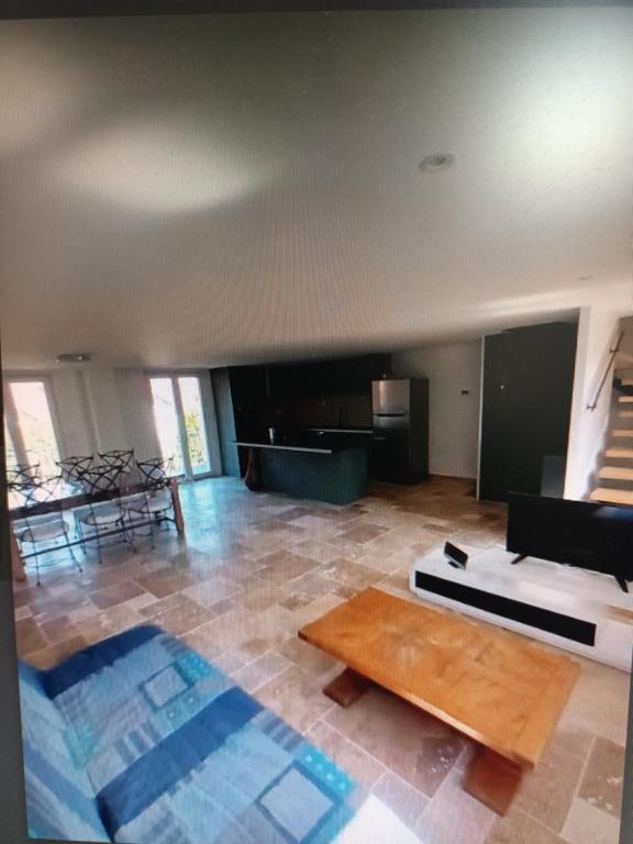 a living room with a couch and a coffee table at mahuet florent in Bissy-sous-Uxelles