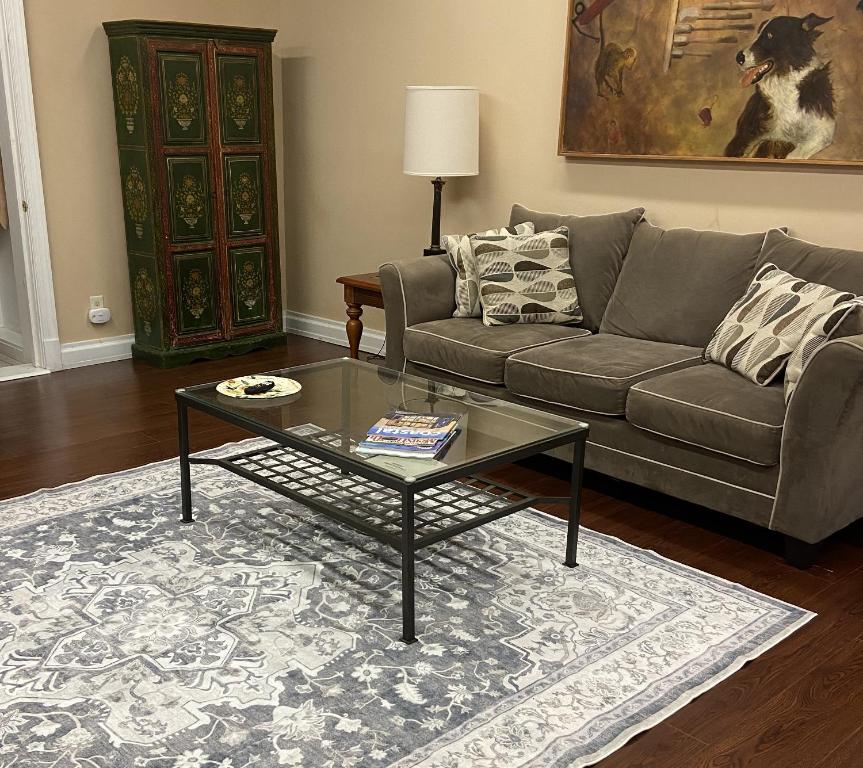 a living room with a couch and a coffee table at 2 bed, 1 bath riverfront loft in Salisbury