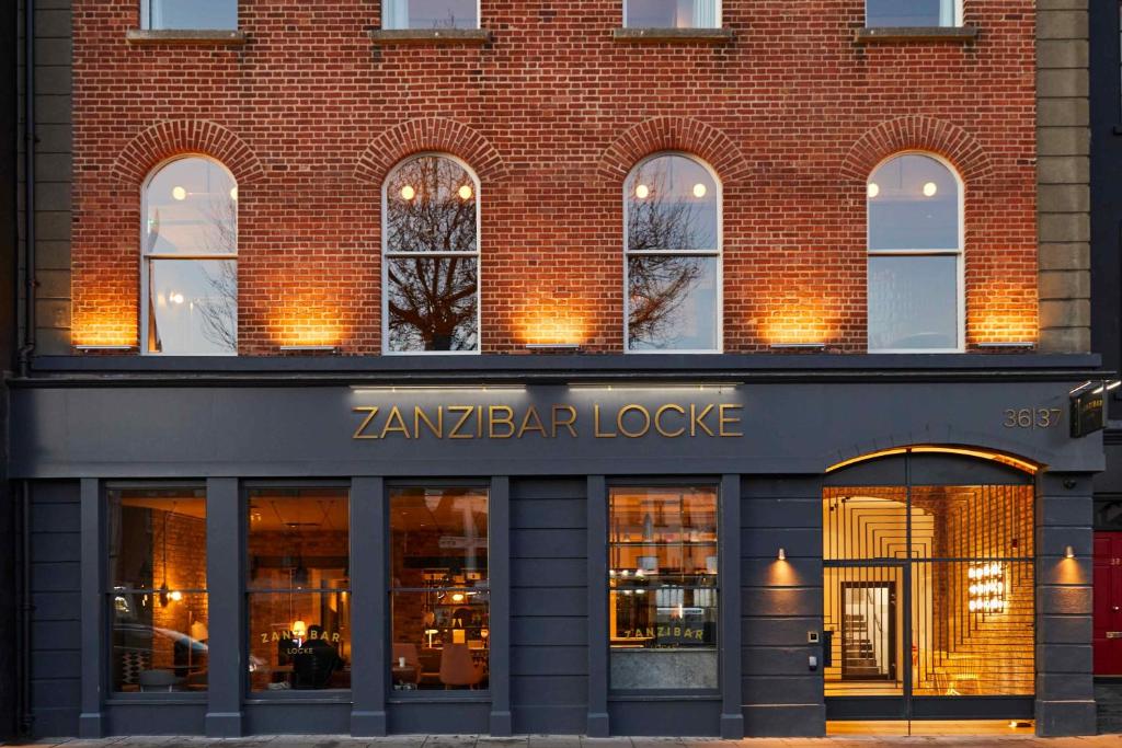 a red brick building with a zebra bar lodge at Zanzibar Locke in Dublin