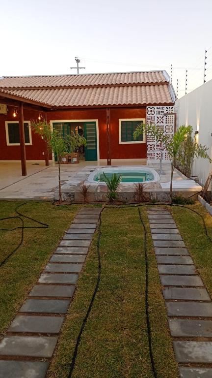 a house with a swimming pool in the yard at Solar da Colina in Petrolina