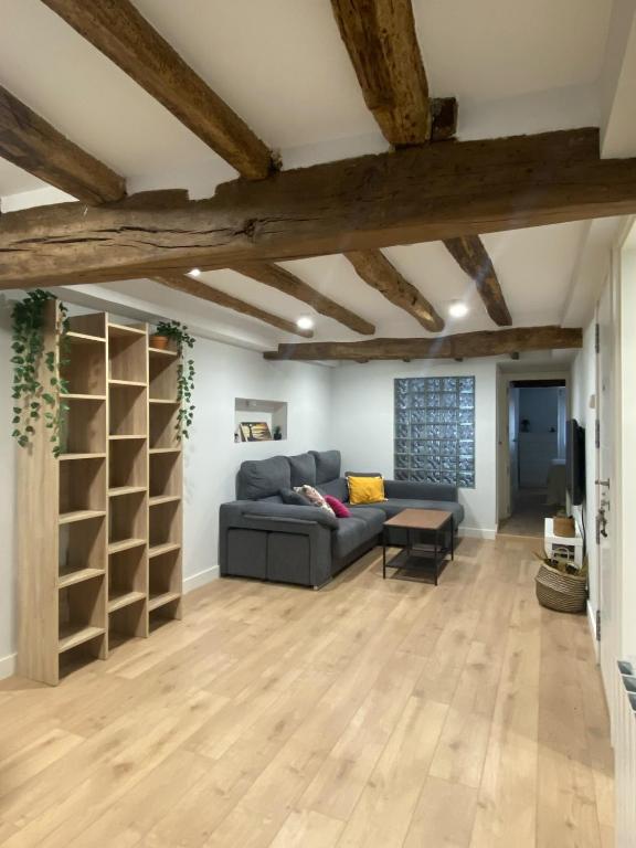 a living room with a couch and a table at Earra - Salegi - 2 minutos playa in Zarautz