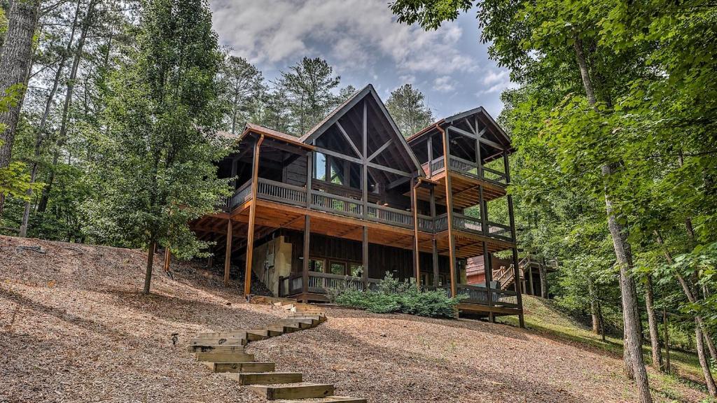 a large wooden house in the woods at Living Waters in Blue Ridge